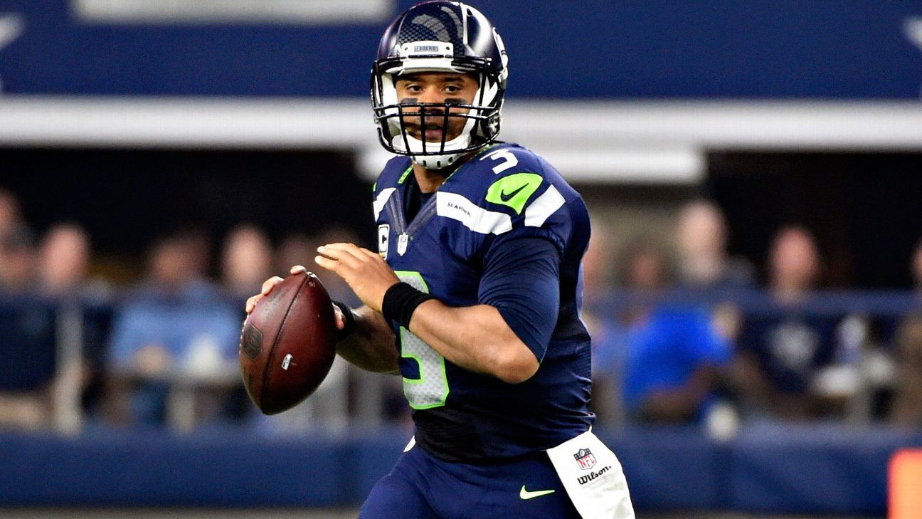 Russell Wilson flips airport sign featuring J.J. Watt
