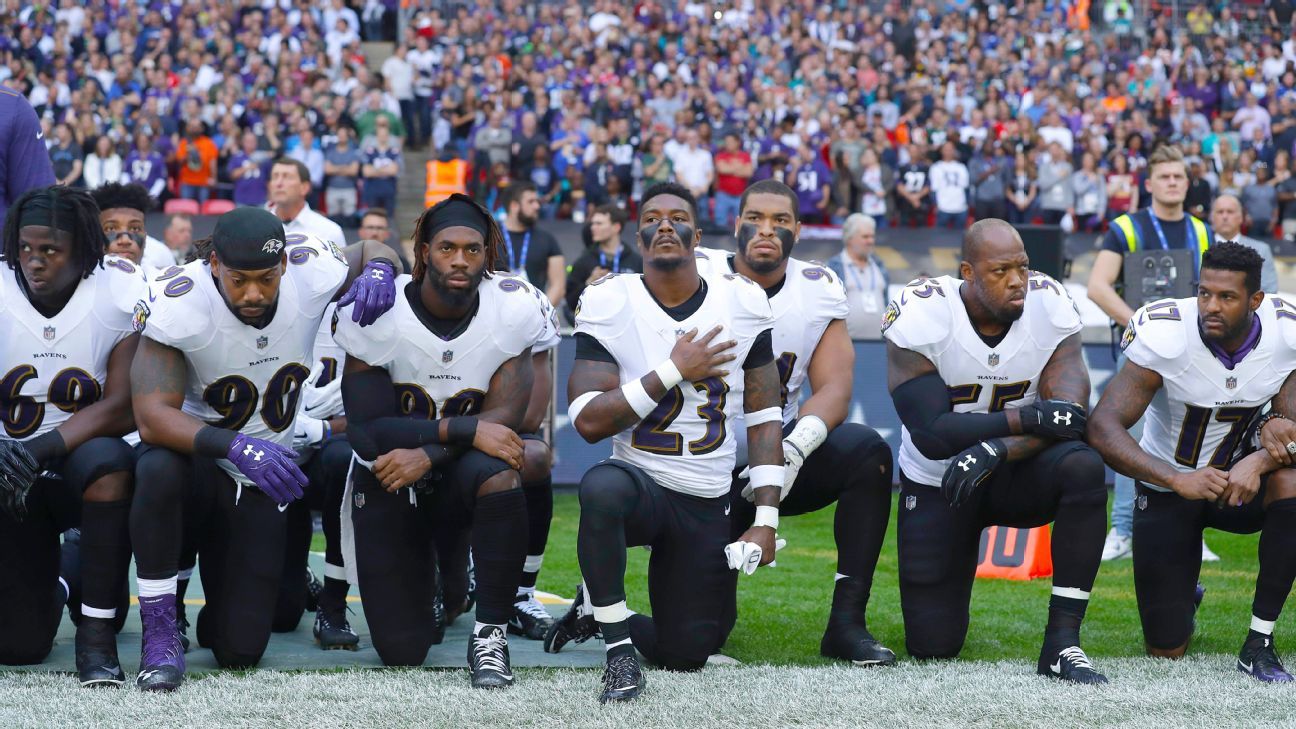 NFL players, coaches, owners kneel, lock arms during national anthem