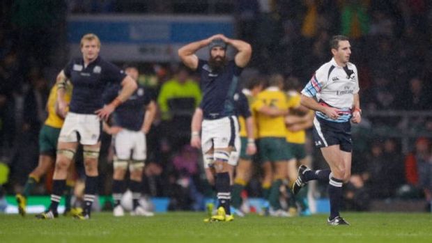 Referee Craig Joubert runs off the pitch after blowing the final whistle