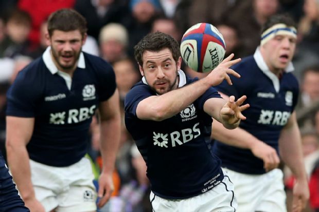 Greig Laidlaw offloads the ball against England