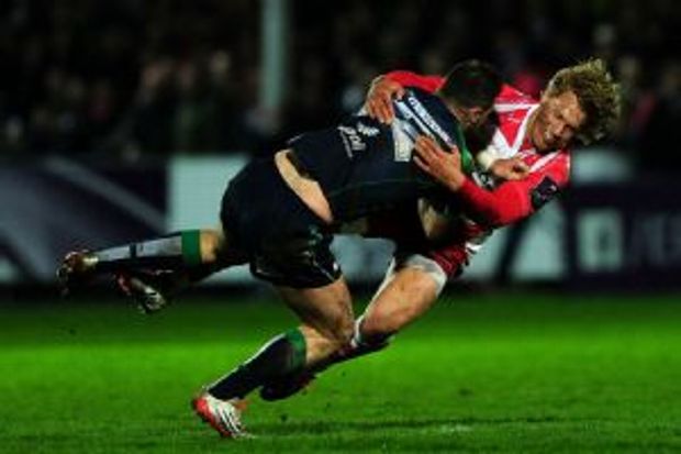 Connacht's Robbie Henshaw is tackled by Gloucester's Billy Twelvetrees