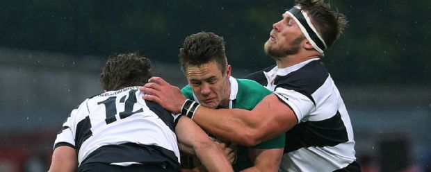 Barbarians' Wynand Oliver and Gerhard Vosloo tackle Ireland's Colm O'Shea