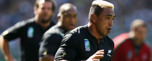 New Zealand's Jerry Collins runs with the ball