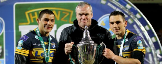 Brian McDermott holds a trophy