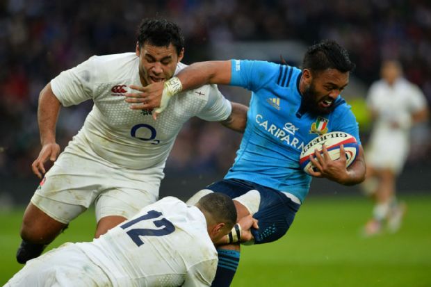 Italy fly-half Kelly Haimona is brought down by England's centre Luther Burrell and number eight Billy Vunipola