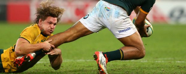 Michael Hooper of the Wallabies tackles Damian de Allende of the Springboks during The Rugby Championship match between the Wallabies and the Springboks