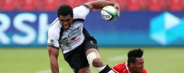 Napolioni Nalaga of Fiji breaks a tackle by Japan's Kotaro Matsuhsima at the 2015 Pacific Nations Cup