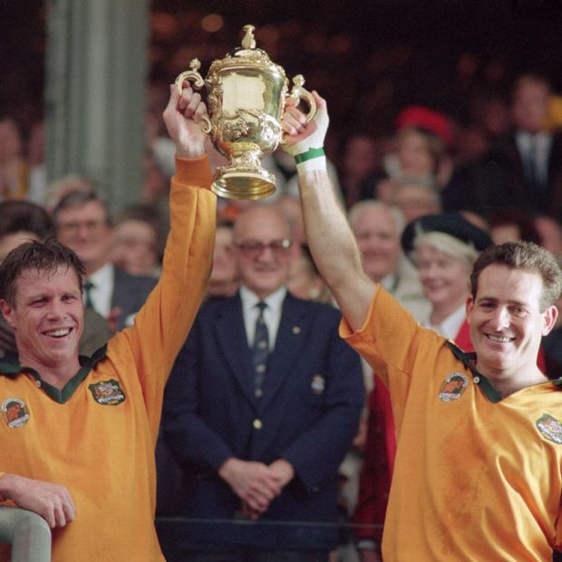 Nick Farr-Jones (left) and winger David Campese lift the Webb Ellis Cup