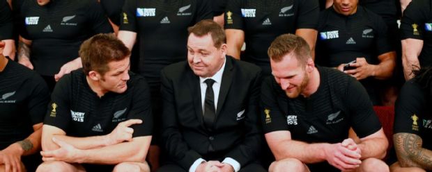 All Blacks coach Steve Hansen sits with Richie McCaw (left) and Kieran Read before New Zealand's Rugby World Cup team photo