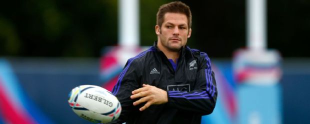Richie McCaw throws a pass during training with the All Blacks