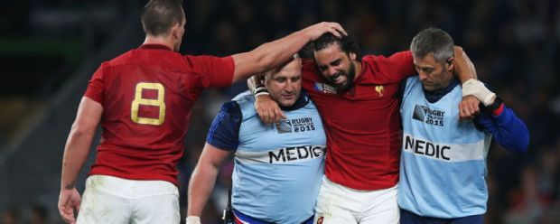Louis Picamoles consoles Yoann Huget as the injured France wing is helped from the field