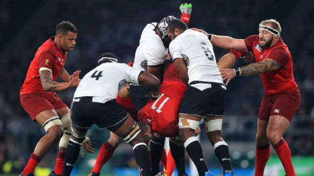 Jonny May is tackled by Dominiko Waqaniburotu