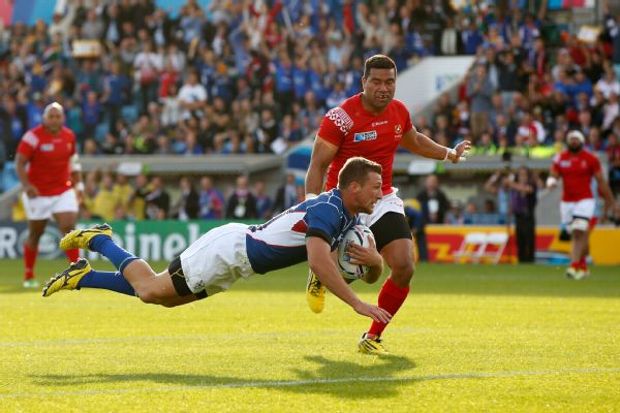 Johan Tromp of Namibia goes over for a try