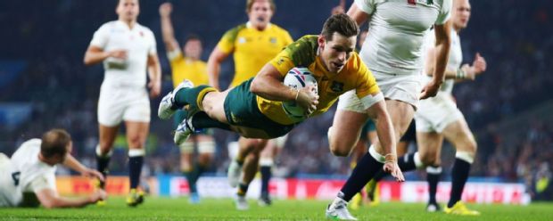 Bernard Foley of Australia goes over to score their second try against England