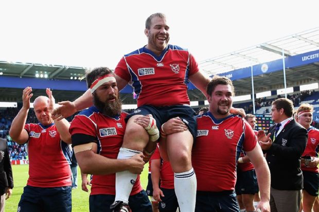 Johnny Redelinghuys of Namibia is carried off the pitch after winning his 50th cap