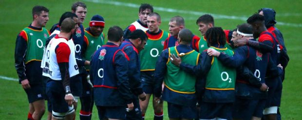 Dylan Hartley speaks with the England players during a training session at Pennyhill Park