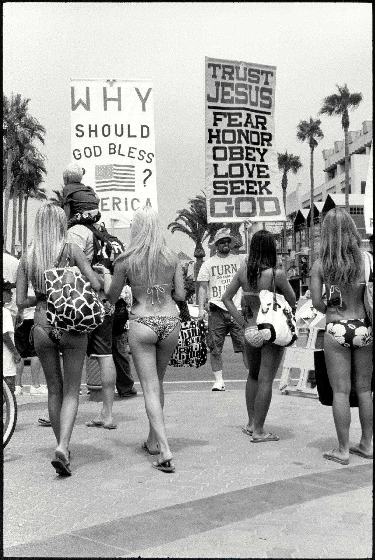 Bikini girls with religious sign