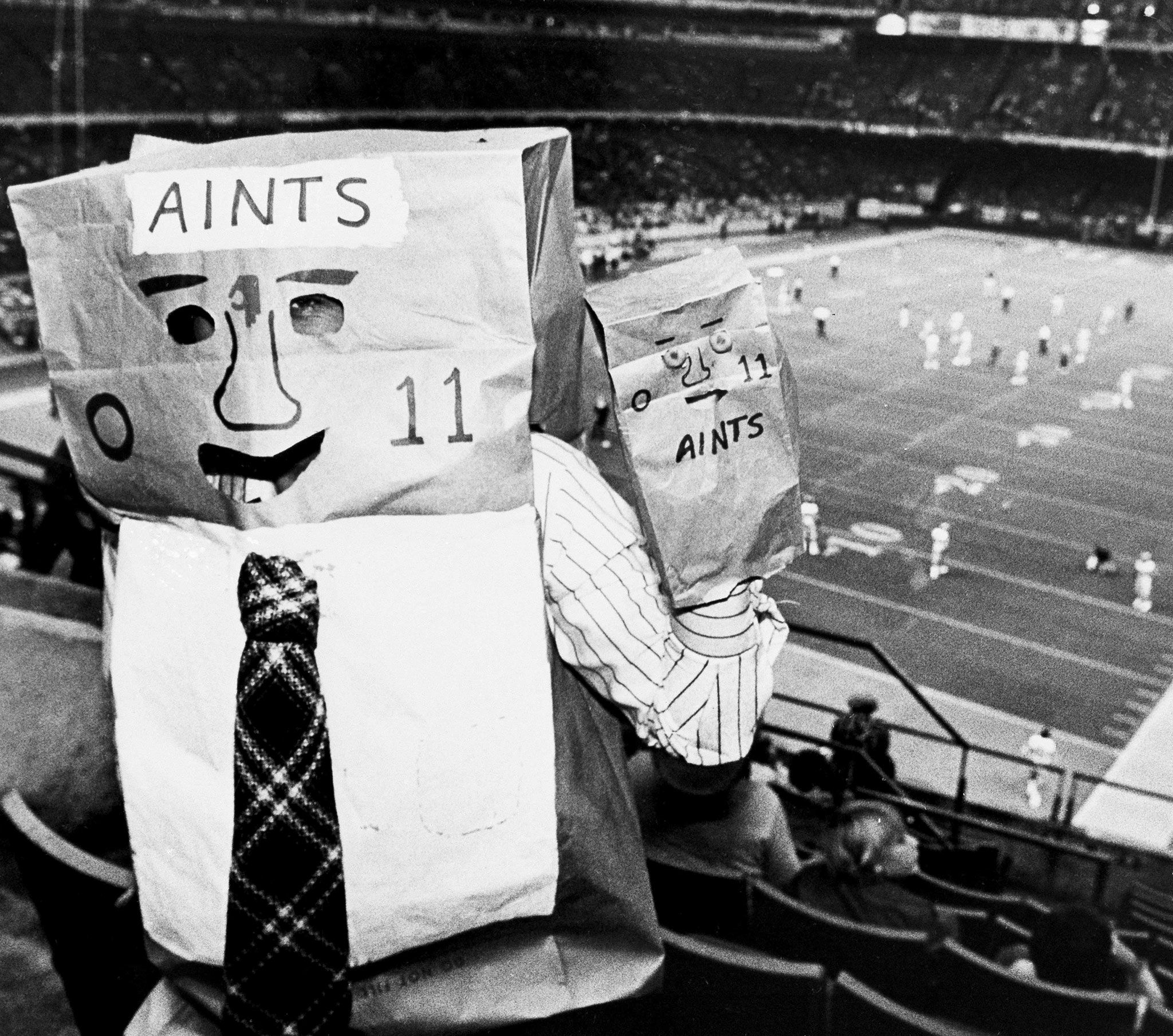 New Orleans Saints Aints fan with paper bag on head and hand 1980.