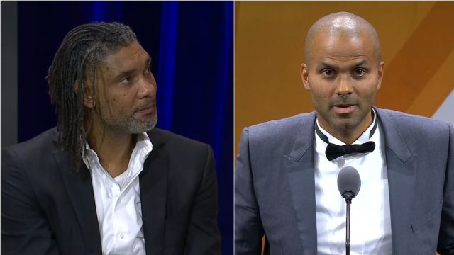 Enshrinee Tim Duncan receives his jacket and ring from Tony Parker