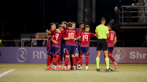 Costa Rica players celebrating against Belize