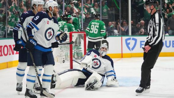Connor Hellebuyck playing goal