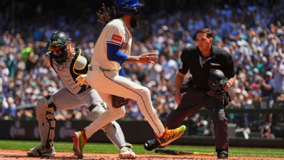 Pirates catcher Henry Davis tags out Seattle's J.P. crawford at the plate following a 105.2 mph throw from Pittsburgh center fielder Oneil Cruz.