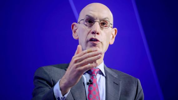 Adam Silver speaking at a podium.
