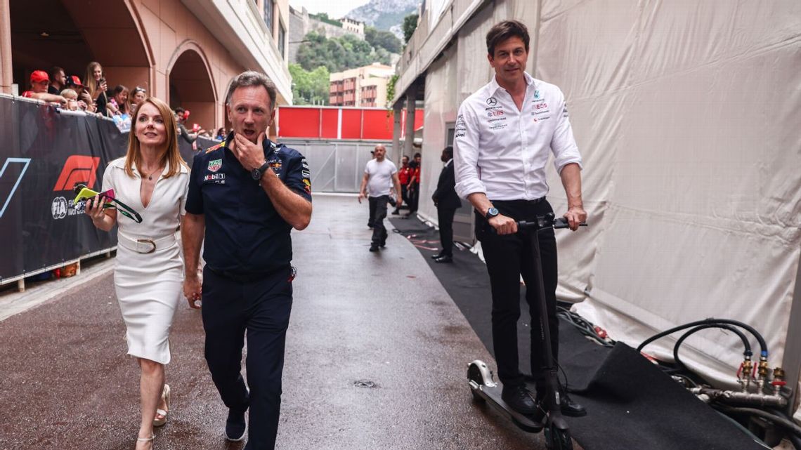 Christian Horner with his wife Geri, and Toto Wolff walking past