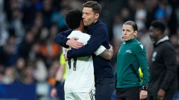 Rodrygo hugs Xabi Alonso following his goal against Manchester City