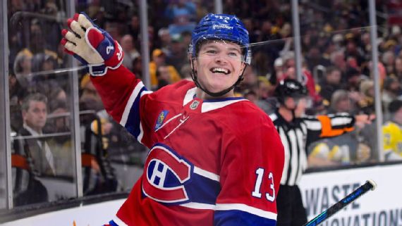 Cole Caufield celebrates after scoring a goal against the Boston Bruins.