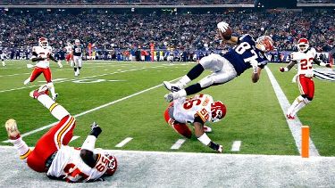 New England Patriots rookie tight end Rob Gronkowski grabs his first NFL  touchdown catch, next to Cincinnati Bengals linebacker Dhani Jones, during  the second half of New England's 38-24 win in an