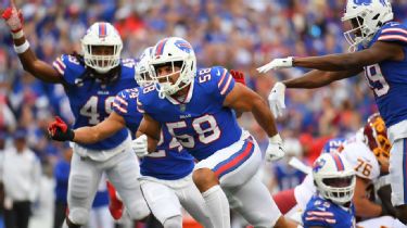 Taron Johnson of the Buffalo Bills tackles Cooper Kupp of the Los