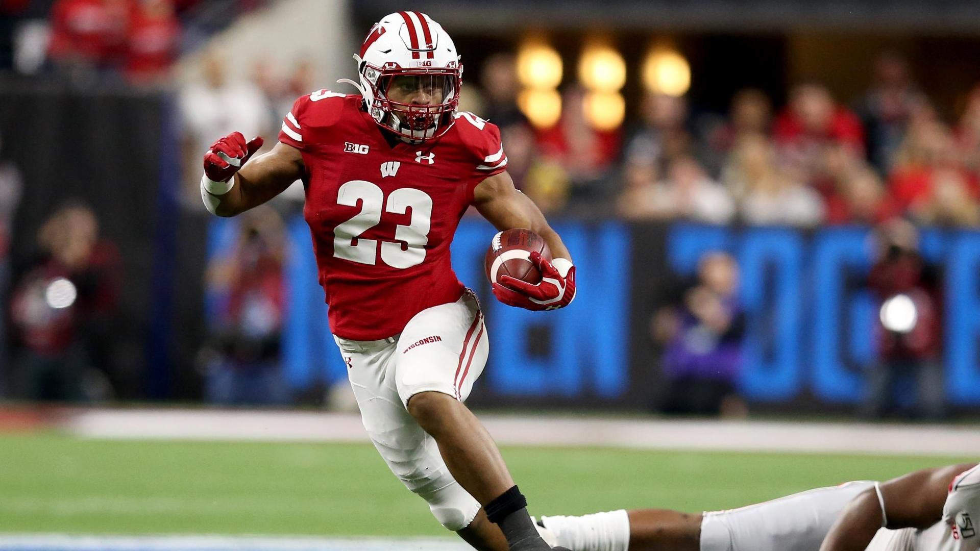 Wisconsin's record-breaking running back Jonathan Taylor is taken by t...