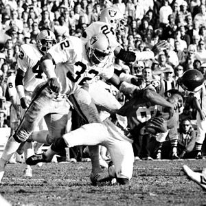 Raiders Jack Tatum, (32) is on the ground as he and Steelers