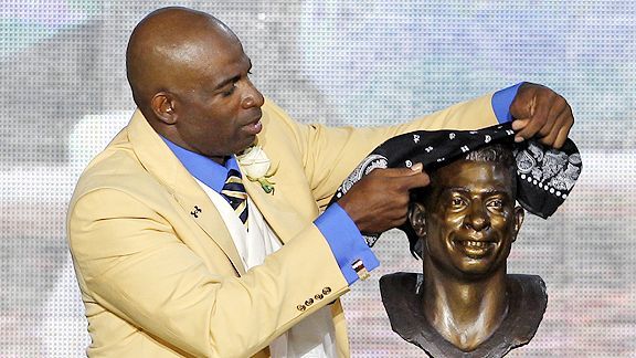 Cornerback Deion Sanders of the Dallas Cowboys prays while