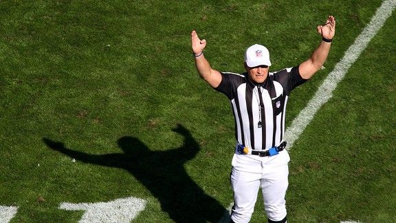 NFL referee Ed Hochuli declares a penalty during the - NARA