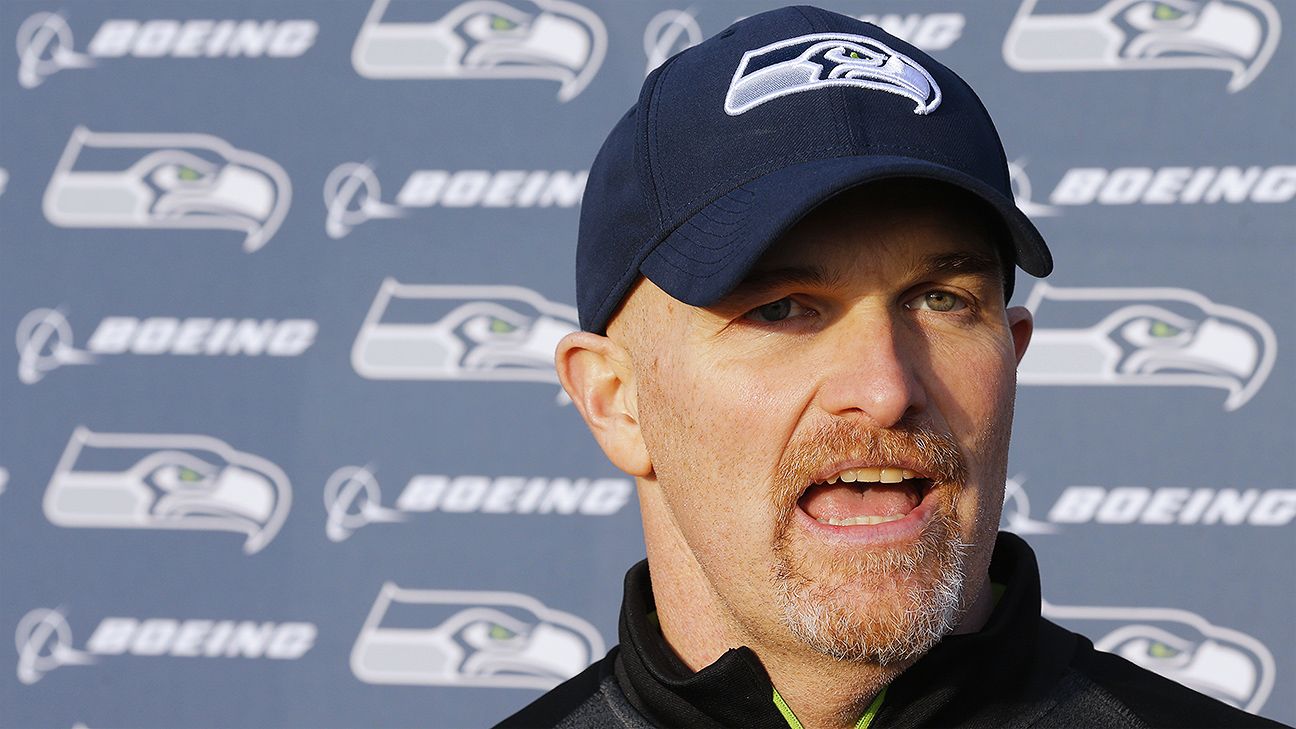 Members of the Seattle Seahawks staff escort Seattle Seahawks