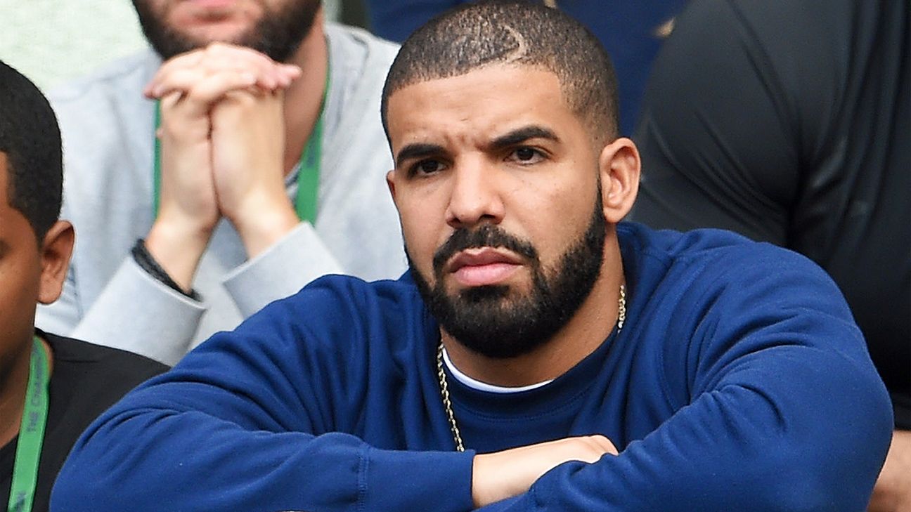 Drake unveils new Toronto Raptors uniforms during concert