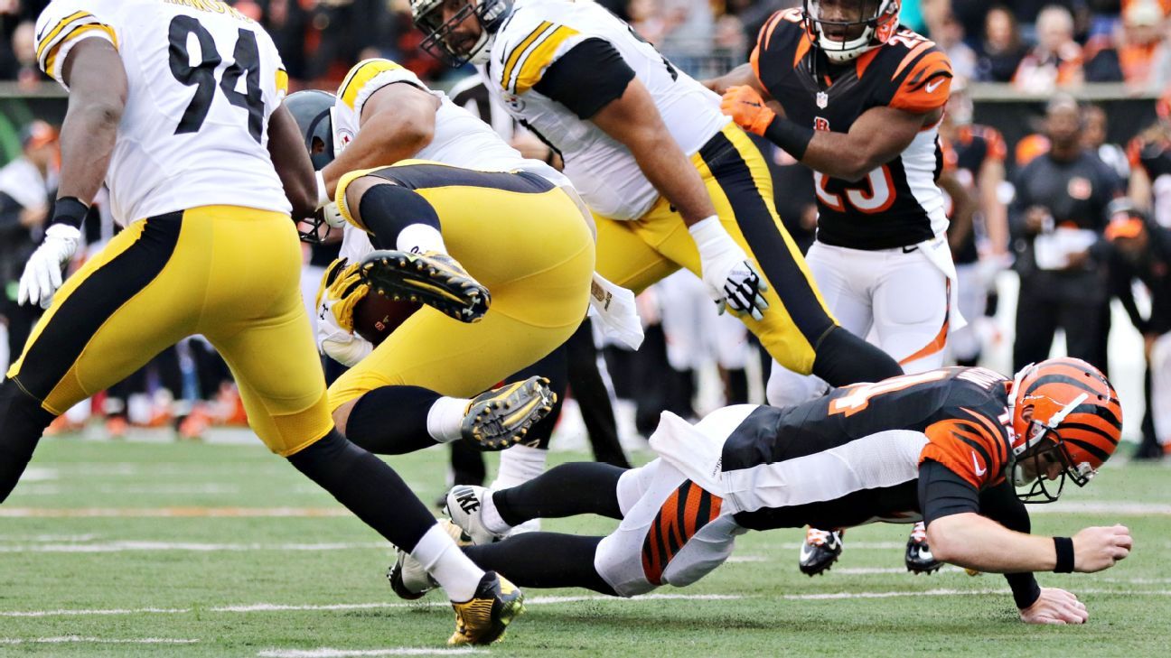 Andy Dalton of the Cincinnati Bengals attempts to break a tackle