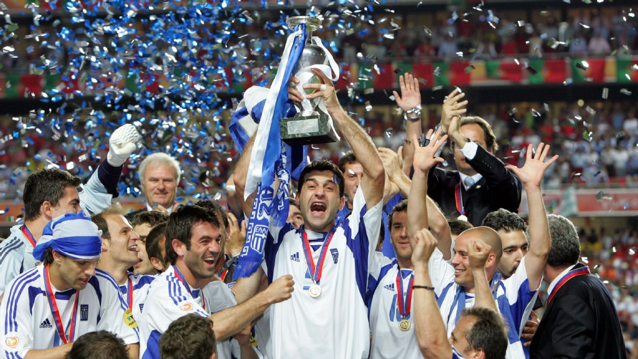  The image shows the Greek football team celebrating their victory in the Euro 2004 tournament.