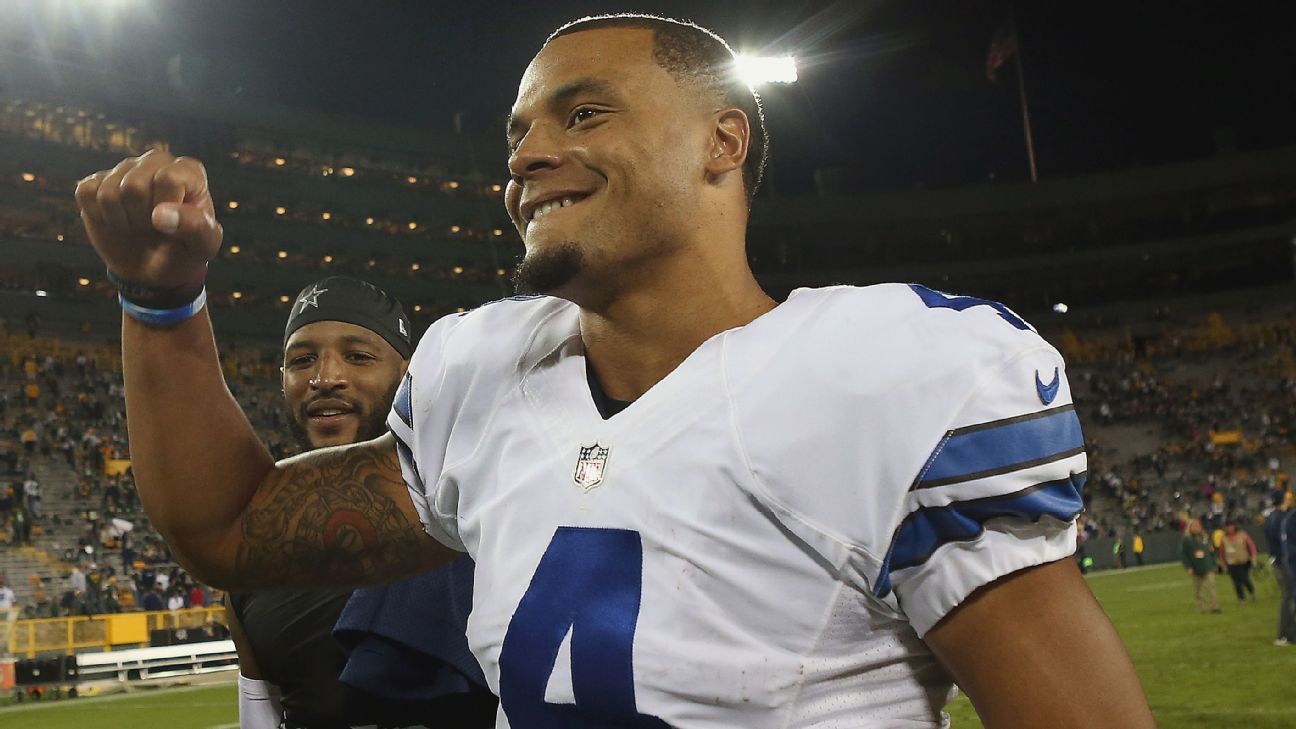 Cowboys roll to 30-16 win, record books in Green Bay