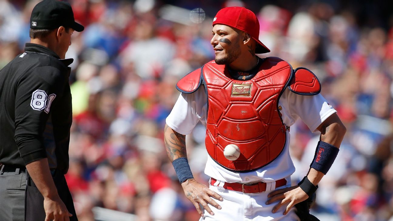 Ball sticks in chest protector of St. Louis Cardinals catcher