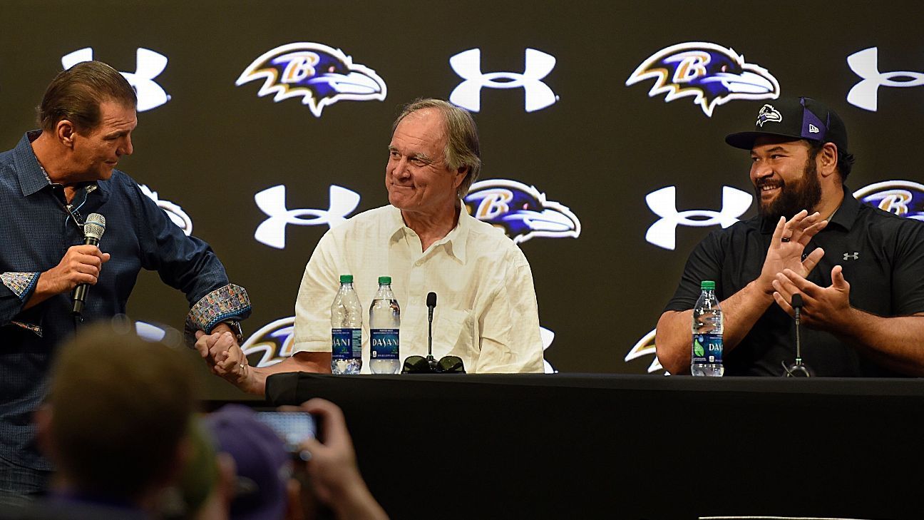 Baltimore Ravens head coach Brian Billick holds the Lombardi