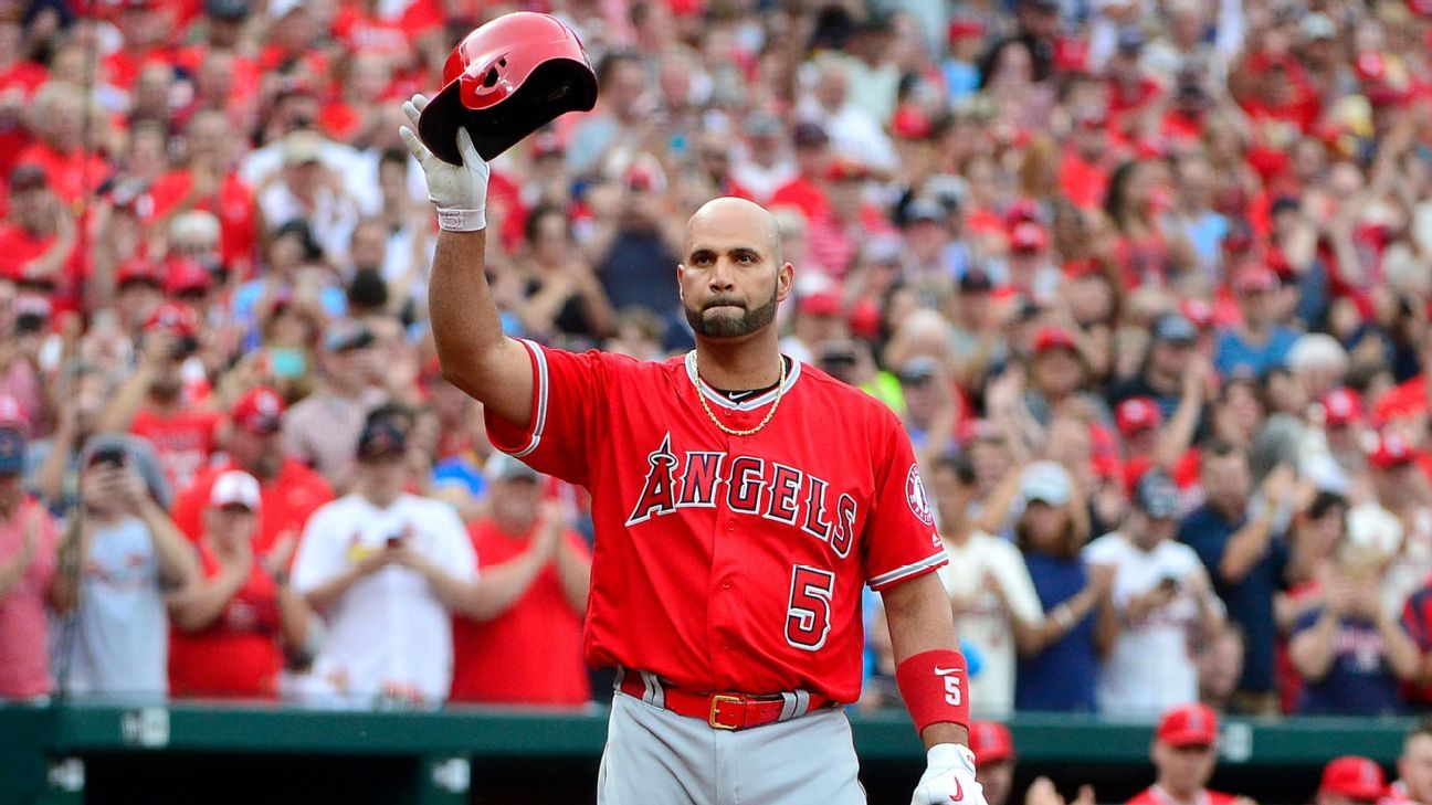 St. Louis Cardinals Albert Pujols tries unsuccessfully to break a bat over  his knee after popping out against the Milwaukee Brewers in the first  inning at Busch Stadium in St. Louis on