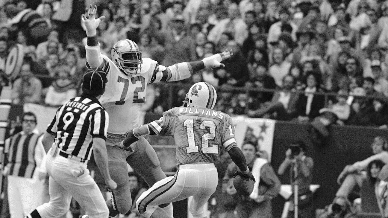 Dallas Cowboys Randy White and Ed Jones in action, making sack vs