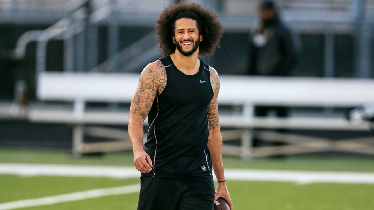 Nevada quarterback Colin Kaepernick, left, scores a touchdown