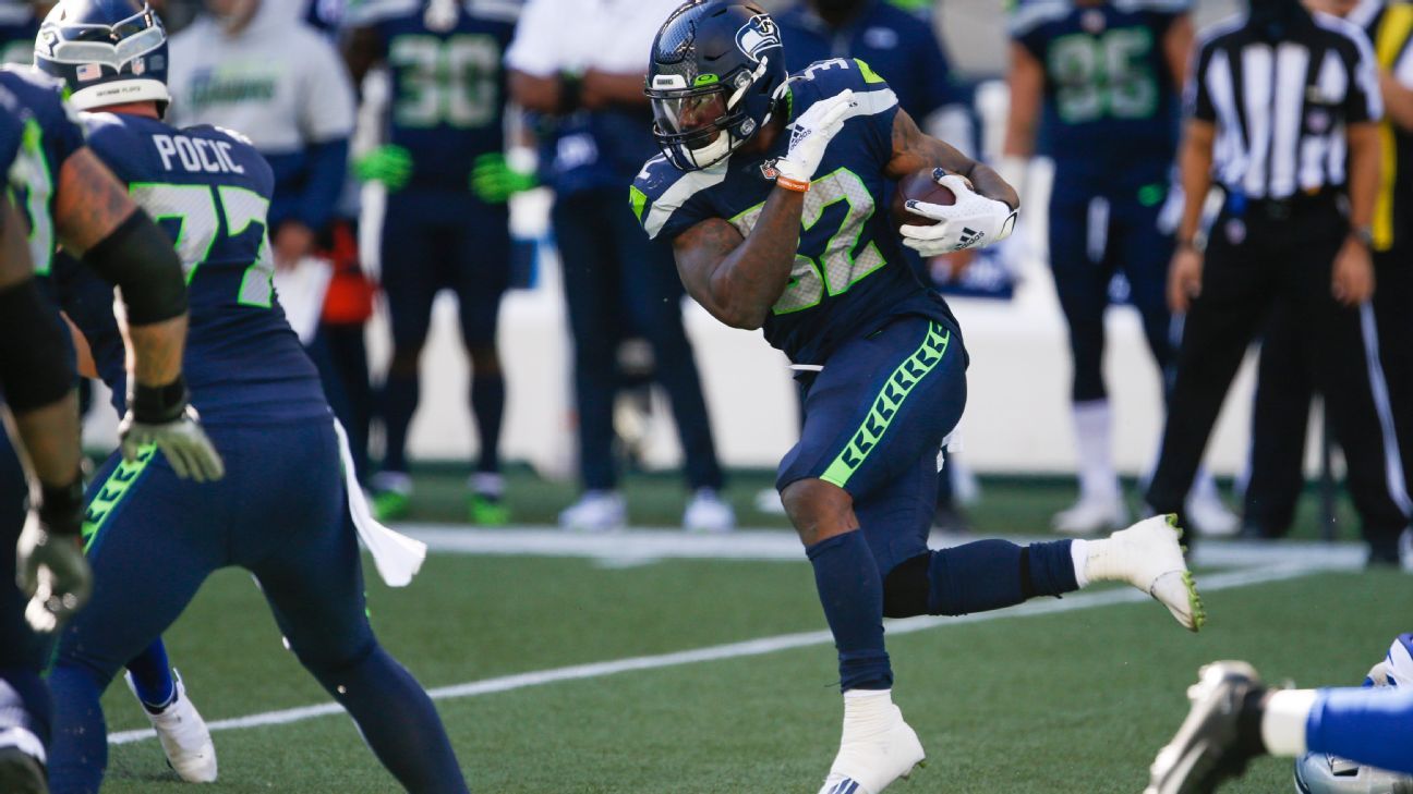 Seattle Seahawks running back Chris Carson gestures while smiling after an  NFL football game against the Dallas Cowboys, Sunday, Sept. 27, 2020, in  Seattle. The Seahawks won 38-31. (AP Photo/Stephen Brashear Stock