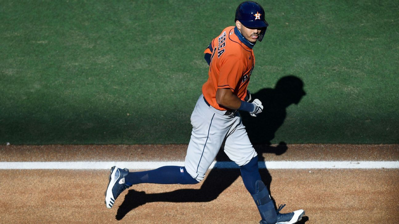 Houston Astros shortstop Carlos Correa hoists the World Series championship  trophy as he walks on the st…