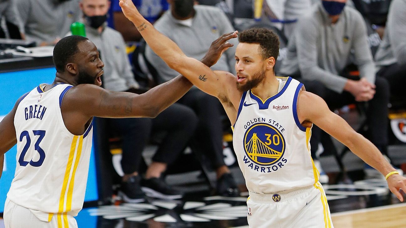 Stephen Curry (30) smiles after making another of his circus shots