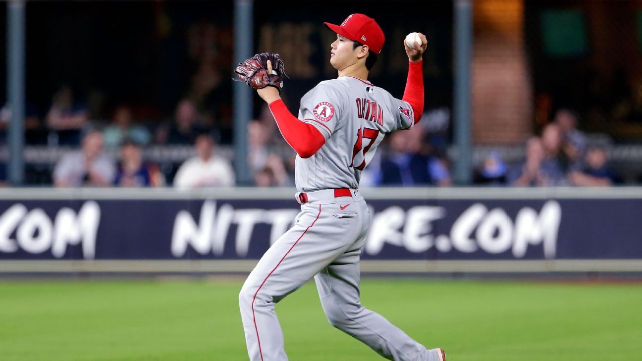 Shohei Ohtani of the Los Angeles Angels puts on pink cleats to celebrate  Mother's Day before a baseball game against the Cleveland Guardians at  Progressive Field in Cleveland, Ohio, on May 14